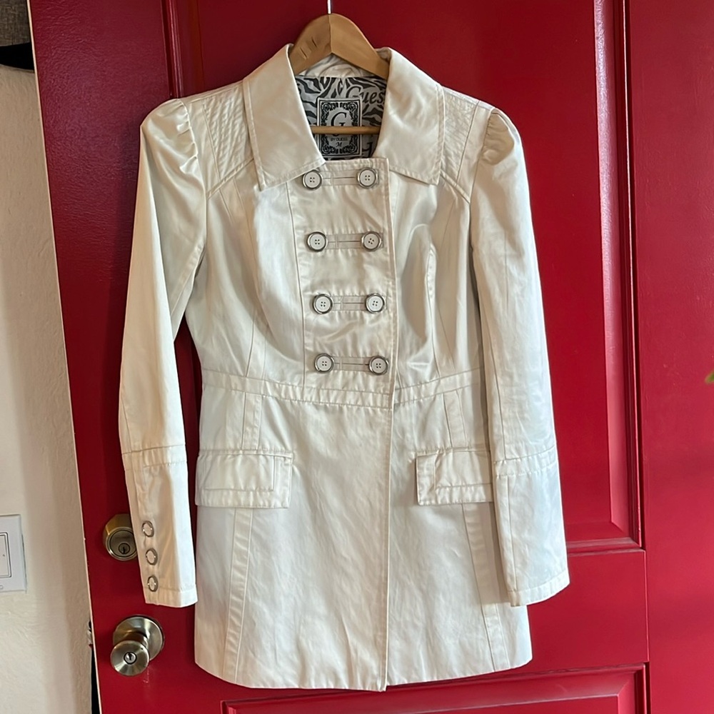 Off White jacket with 14 buttons,3 on each sleeves and 8 in front. Two pockets.